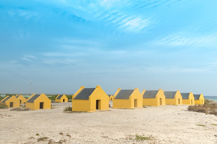 Red slave huts on the Bonaire south coast