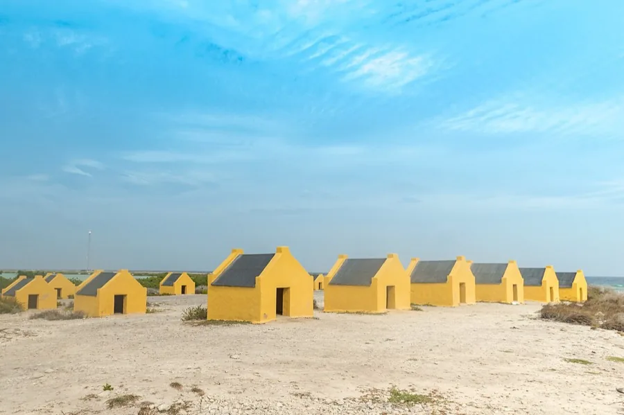 Red slave huts on the Bonaire south coast